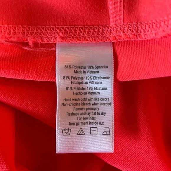 Alo Mid Rise Stash Pocket Leggings in Bright Coral Size Small - Picture 4 of 5